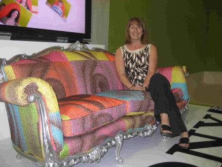 A sofa with a photo mosaic cover